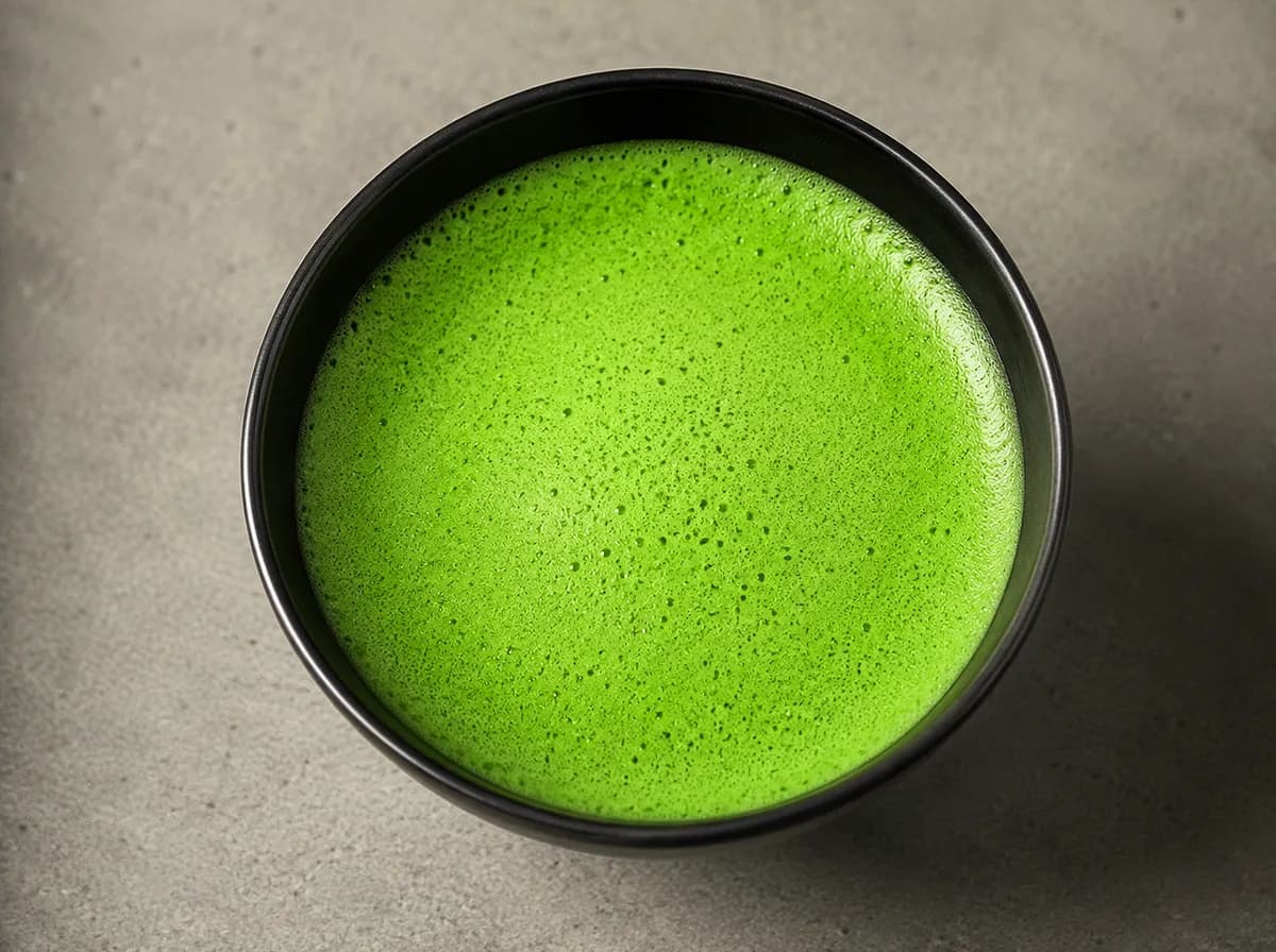 Whisked usucha frothed in a black chawan
