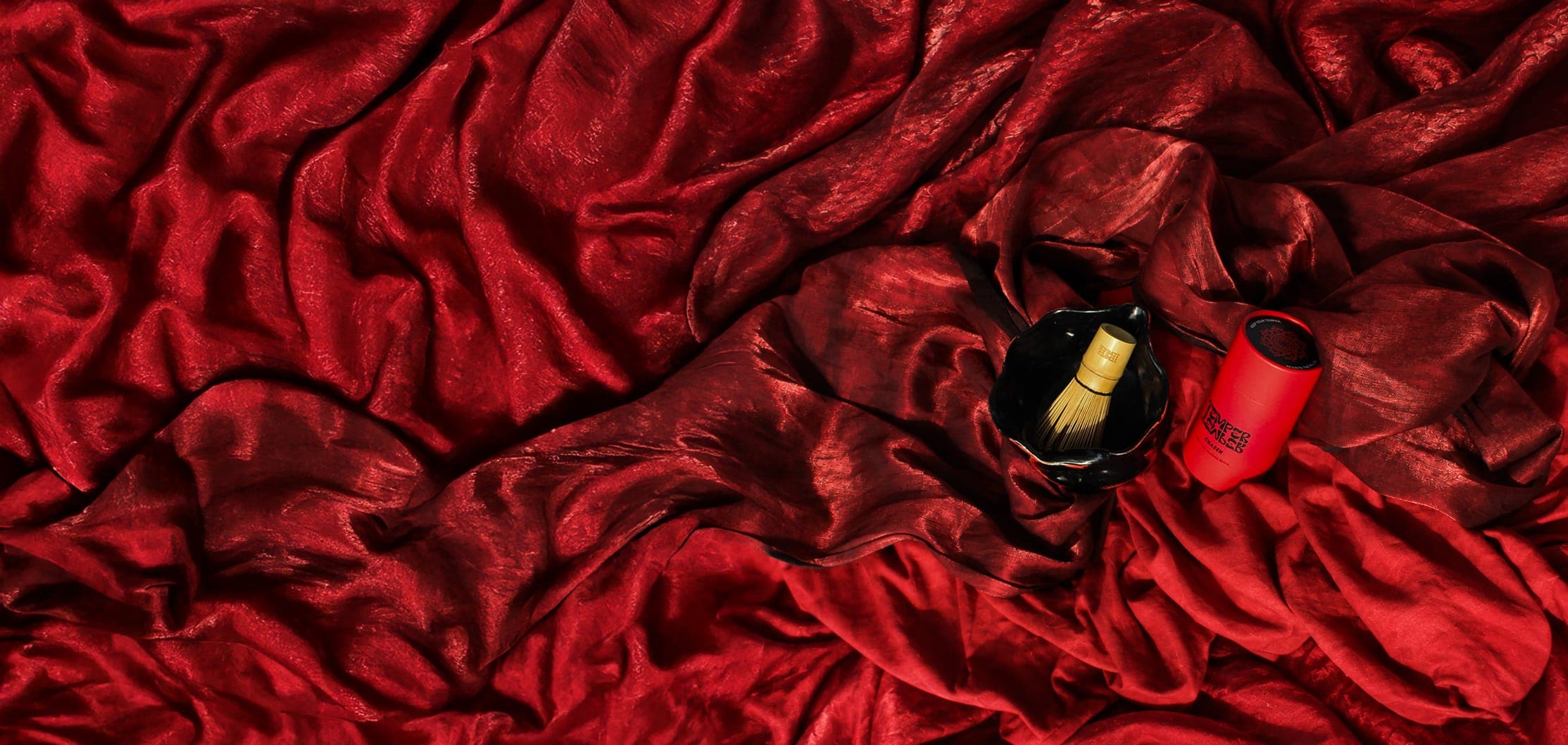 Matcha whisk, bowl and tube on red silk